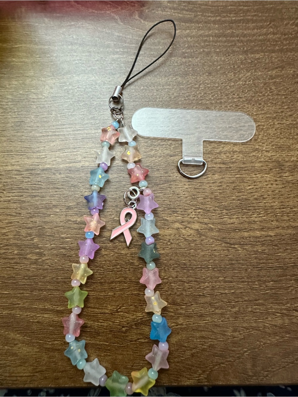 Multicolor Star Bead Phone Charm with Pink Ribbon Accent